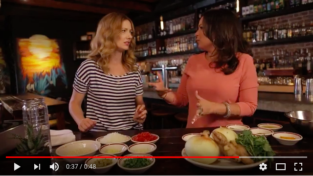 Judy Greer and guest on Reluctantly Healthy cooking show cook the recipe Quinoa con Pollo