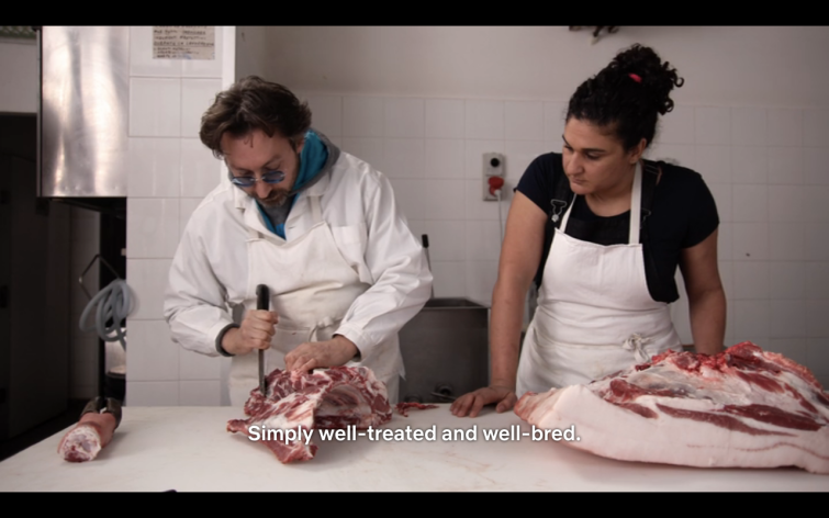 A butcher separates the fat from the meat in "Salt Fat Acid Heat"