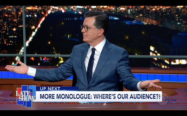 Stephen Colbert at his Late Show desk on March 12 2020. Chyron says "Up Next More Monologue: Where's Our Audience?!"