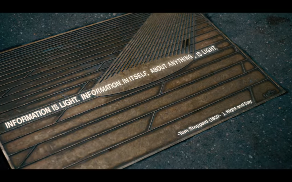 New York City street plaque reads: "Information is light.  Information, in itself, about anything, is light.  -Tom Stoppard (1937-), Night and Day"
From "Pretend It's a City" on Netflix 2021